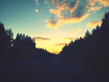 Scenic view of road at sunset