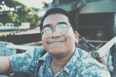 Portrait of smiling young man outdoors