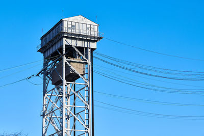 Tower of two-tier vertical lift bridge. bunk bridge in kaliningrad city. blue sky background