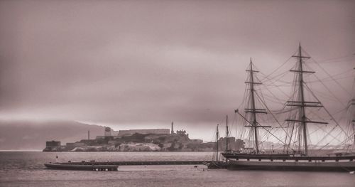 Ship sailing on sea against sky