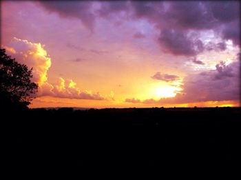 Scenic view of landscape against cloudy sky