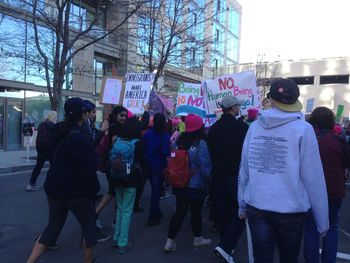 Rear view of people in city