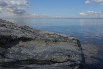 Scenic view of sea against cloudy sky