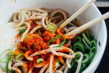 Close-up of soba noodles in bowl in table