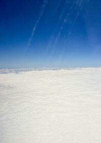 Scenic view of landscape against blue sky