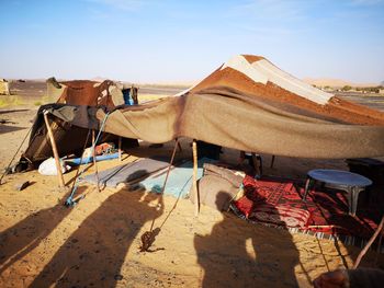 Panoramic view of people on desert against sky