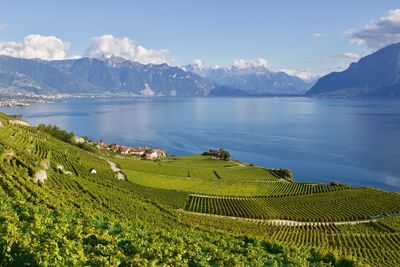 Scenic view of sea and mountains against sky