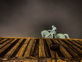 Low angle view of statue against sky