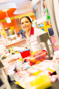 Portrait of woman working in store
