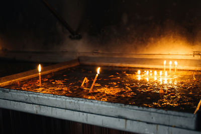 Reflection of illuminated lights on water at night