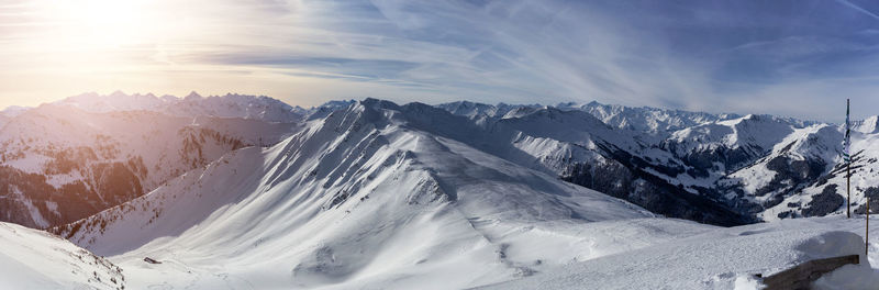 Scenic view of snowcapped mountains against sky during winter