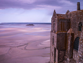 Historic building against sky at mont saint-michel