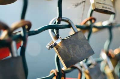 Close-up of padlocks on fence