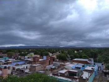 High angle view of townscape against cloudy sky