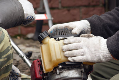 Close-up of man working at machine