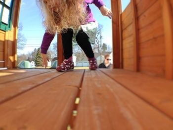 Low section of man standing on footpath