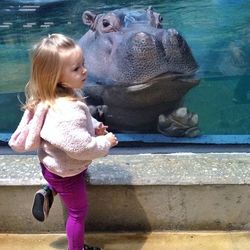 Full length of girl standing in water