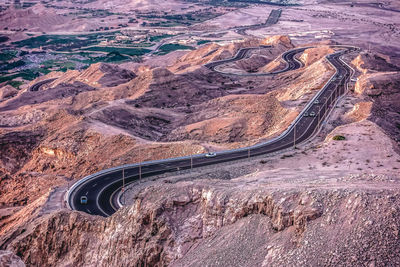 High angle view of tire tracks on road