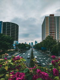 Street amidst buildings in city against sky