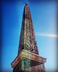 Low angle view of building against blue sky