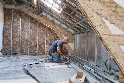 Construction worker working with tools at site