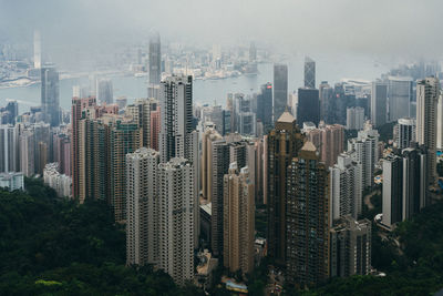 High angle view of buildings in city against sky