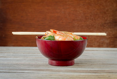 Close-up of red juice in bowl on table