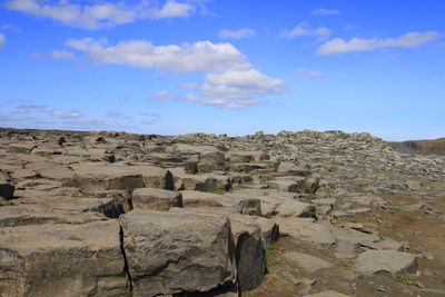 Scenic view of rock formations against sky