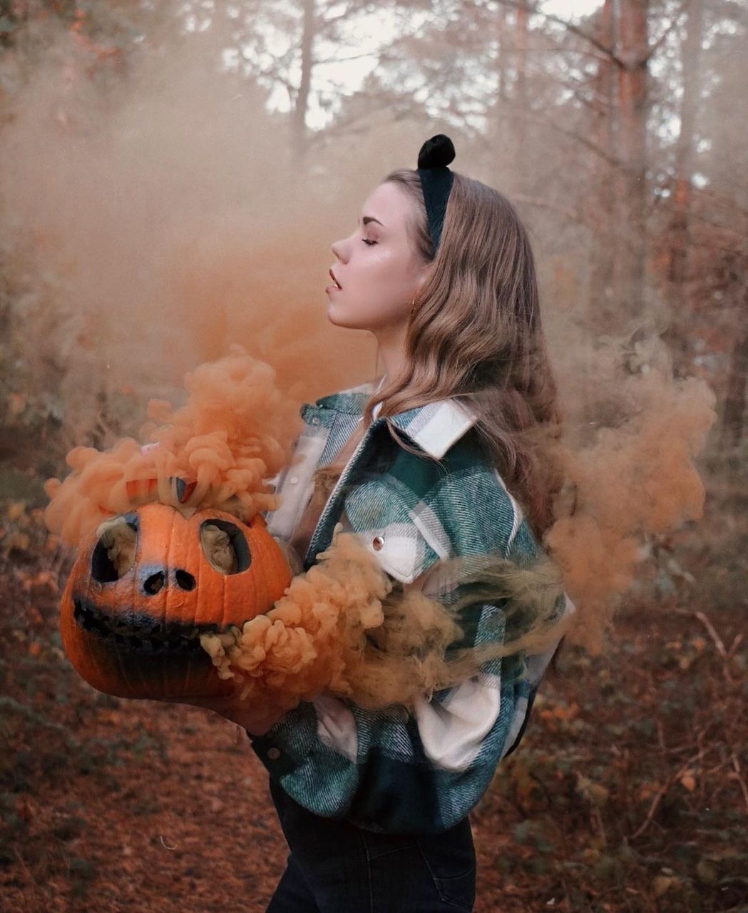 childhood, one person, child, autumn, halloween, women, holding, nature, celebration, female, standing, smiling, costume, waist up, forest, adult, tree, fantasy, emotion, clothing, spooky, toy, three quarter length, outdoors, cute, pumpkin, land, day, food, person, dressing up, plant, happiness, food and drink, holiday, innocence, lifestyles