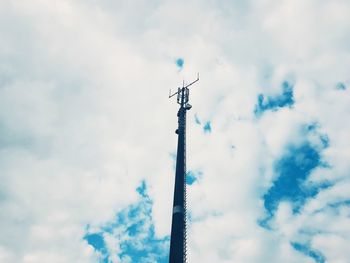 Low angle view of communications tower against sky