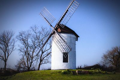 Low angle view of windmill against clear sky