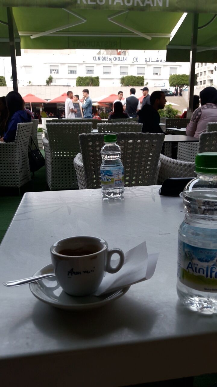 PEOPLE SITTING AT RESTAURANT