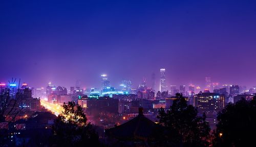 Aerial view of illuminated cityscape at night