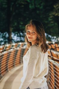 Portrait of smiling young woman outdoors