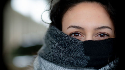 Close-up portrait of woman in winter