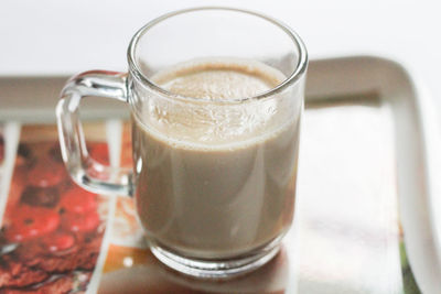 Close-up of coffee cup on table