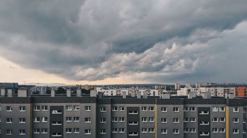 Buildings in city against sky