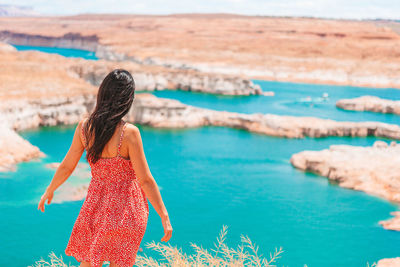 Young woman standing at beach