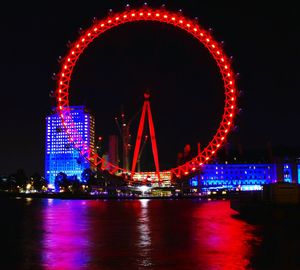 View of ferris wheel at night
