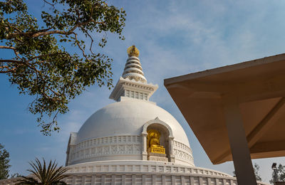 Buddhist stupa isolated with amazing blue sky from unique perspective