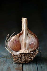 Close-up of bread on table against black background