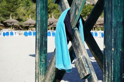 Close-up of wooden posts on beach