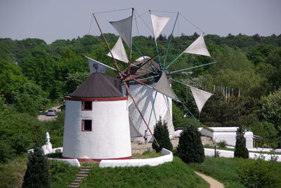 Traditional windmill against sky