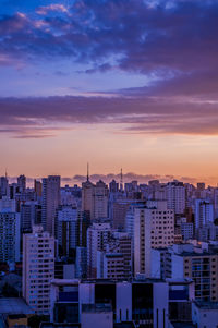 High angle view of buildings against sky during sunset