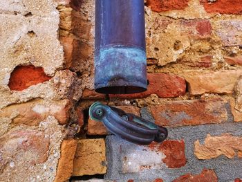 Close-up of rusty pipe on wall