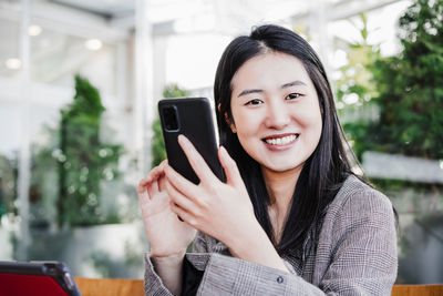 Young woman using mobile phone