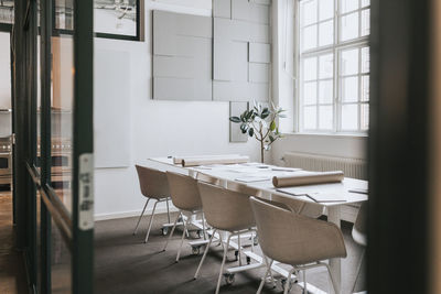 Chairs and tables arranged at work place