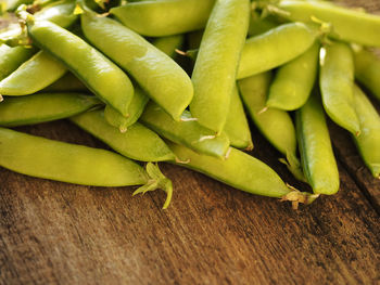 Close-up of green peas on table