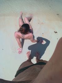 High angle view of boy playing on beach