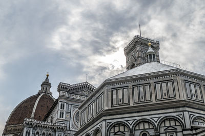 The top of the giotto bell tower, the baptistery and the cathedral in duomo square in florence